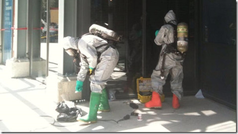 Toronto G20 Man arrested in odd car - hazmat suit guys