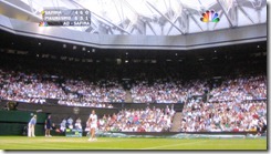 wimbledon 2009 - closing centre court roof - first time 10 - safina serving after play had resumed under closed roof