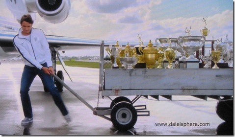 2009 french open - federer pulls dolly full of trophies in humorous west jet congratulatory commercial