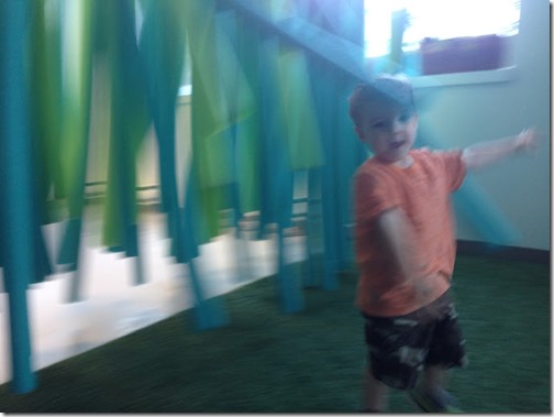 Zach Running through hanging things - discovery centre