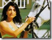 caterina murino - casino royale (2006) holding horse steady on the beach