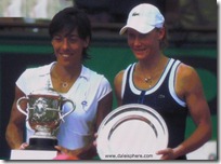 francesca schiavone and samantha stosur hold trophies at french open 2010