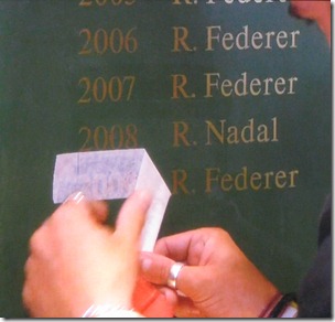 wimbledon 2009 - federer's name being added to the winner's roster in lobby